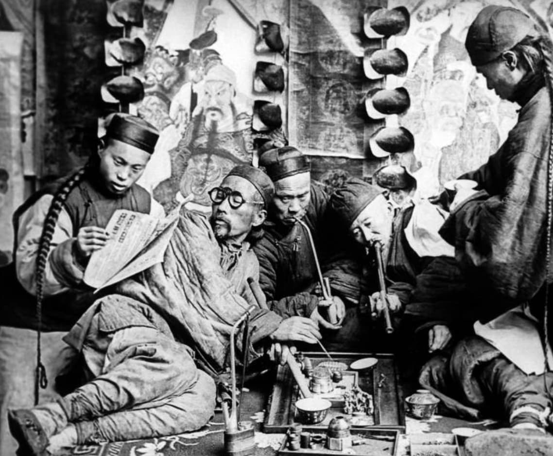 Folks getting high at an Opium den in China, 1901. 